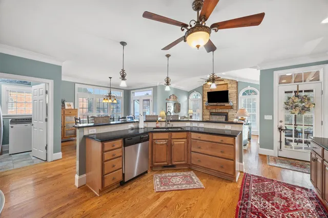 a open kitchen with stainless steel appliances granite countertop a stove and cabinets