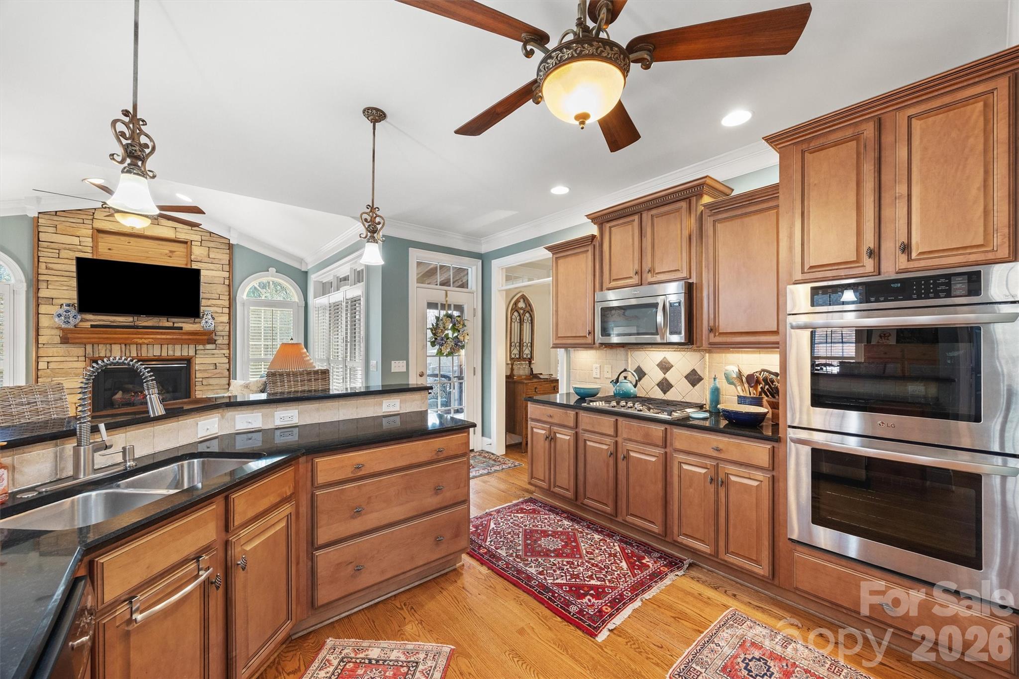 1177 Springlake Road York, SC 29745 - Photo 12 of 48 a kitchen with stainless steel appliances granite countertop a stove a sink and a microwave