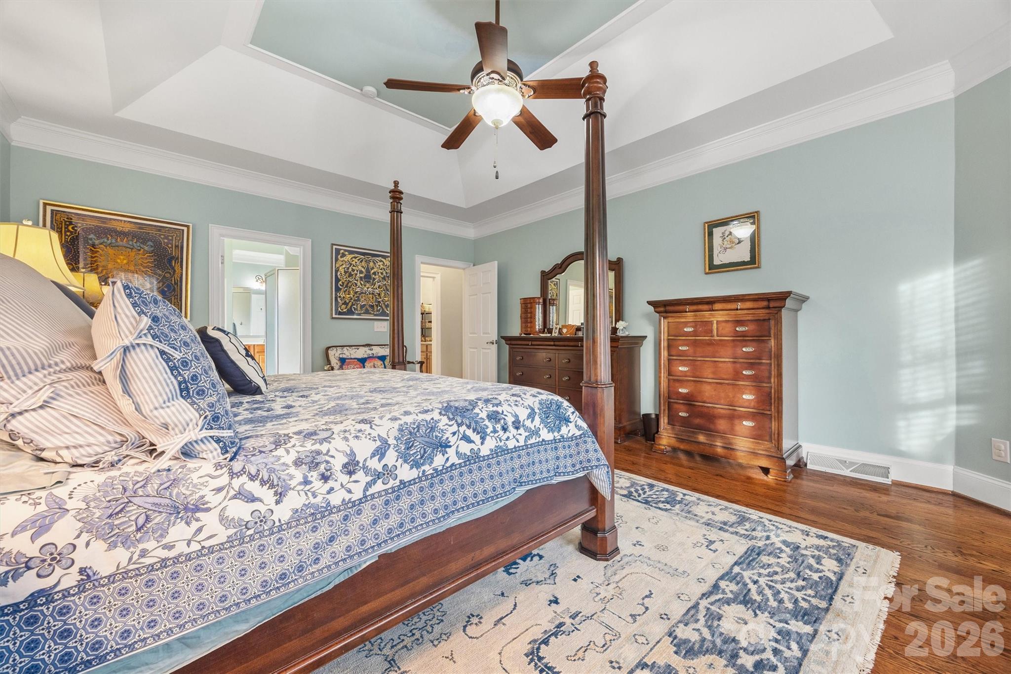 1177 Springlake Road York, SC 29745 - Photo 21 of 48 a bed sitting in a spacious bedroom next to a window and a chandelier