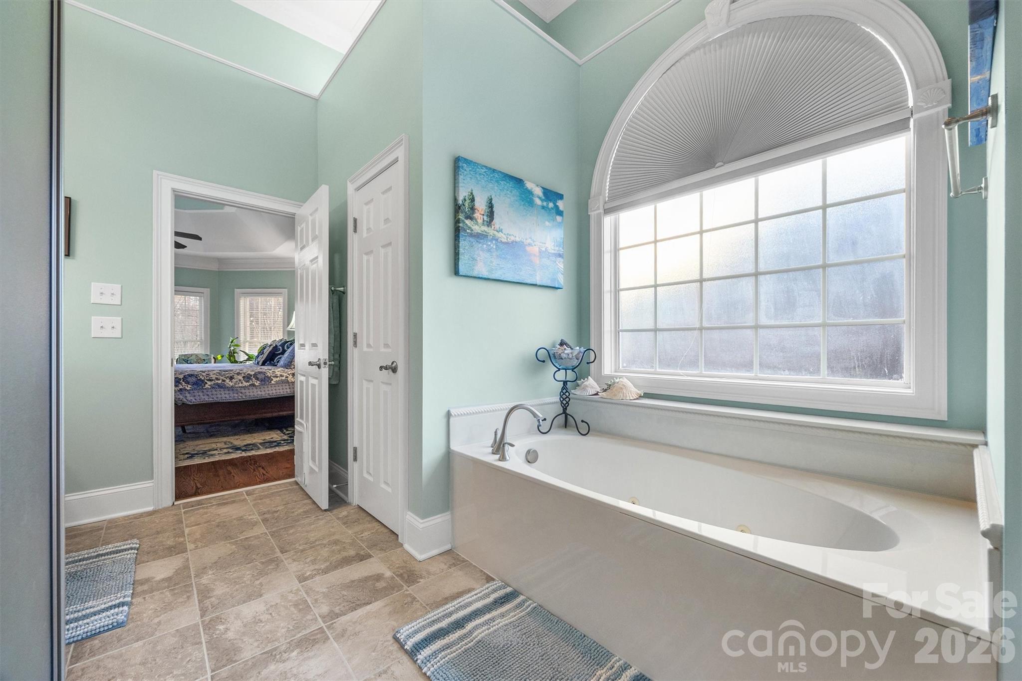 1177 Springlake Road York, SC 29745 - Photo 24 of 48 a spacious bathroom with a tub and a large window