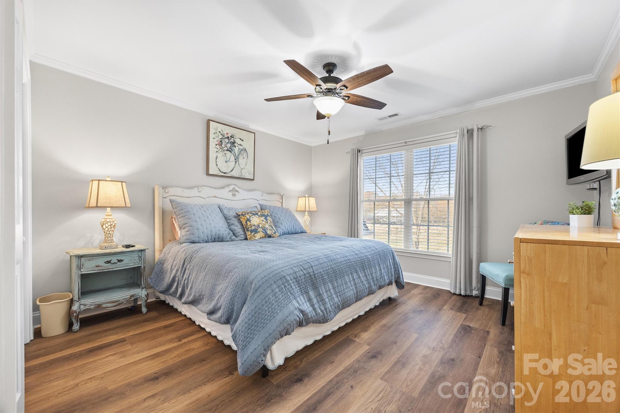 1177 Springlake Road York, SC 29745 - Photo 30 of 48 a spacious bedroom with a bed and a flat screen tv