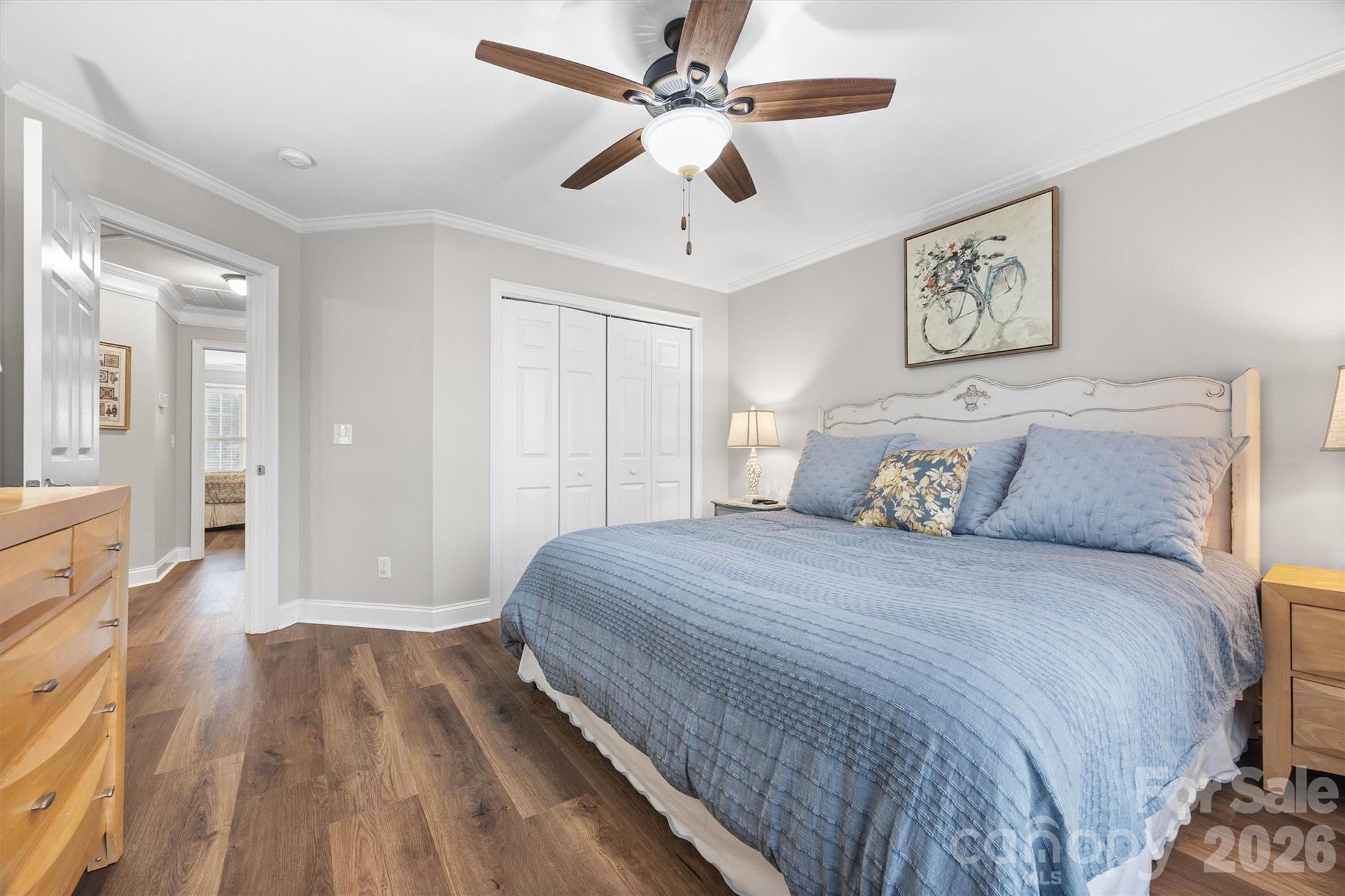1177 Springlake Road York, SC 29745 - Photo 31 of 48 a spacious bedroom with a bed and a chandelier