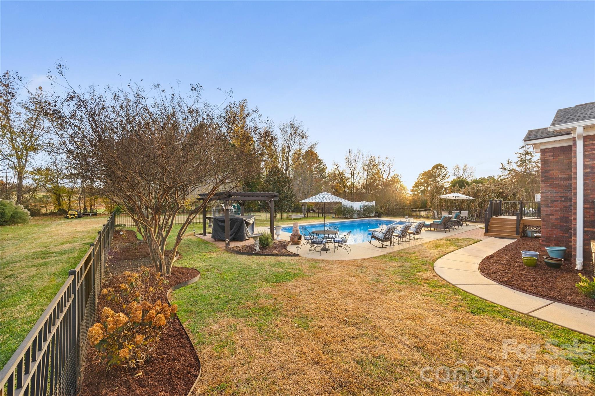 1177 Springlake Road York, SC 29745 - Photo 40 of 48 a view of a yard with swimming pool and trees