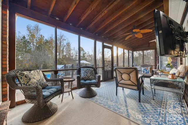 a outdoor living space with furniture and a fireplace