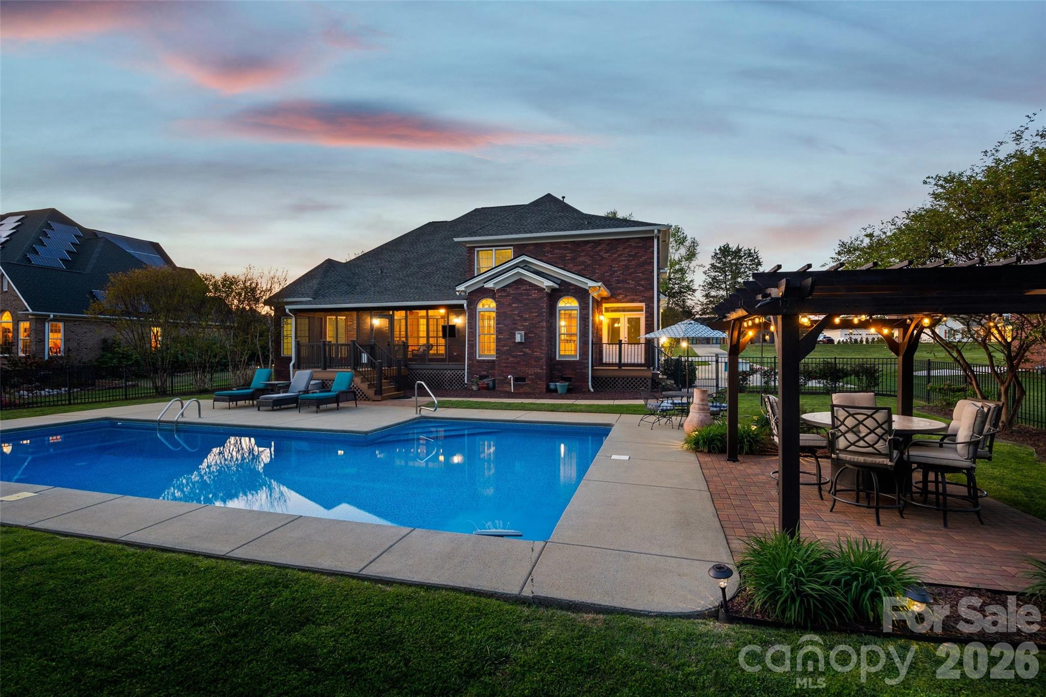 1177 Springlake Road York, SC 29745 - Photo 44 of 48 a view of swimming pool with lawn chairs under an umbrella