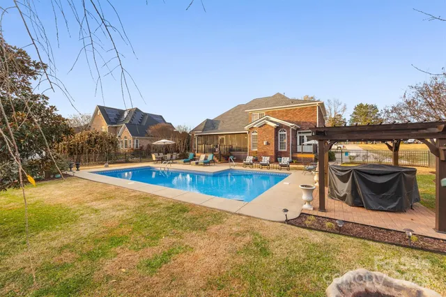 a view of a swimming pool with a lounge chairs