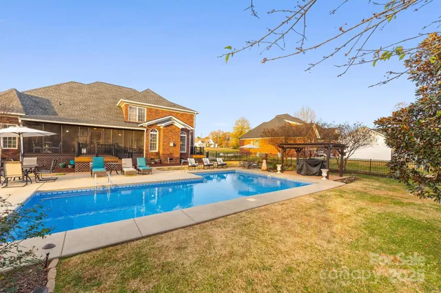 a view of a house with swimming pool