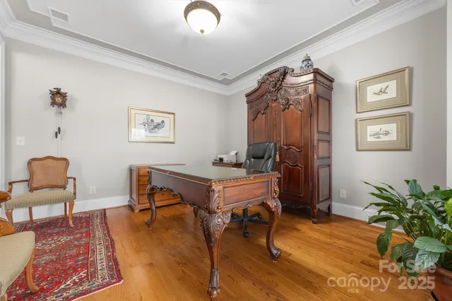 a view of a livingroom with furniture and a workspace
