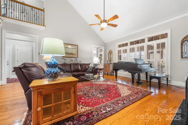 a living room with furniture a rug and a window