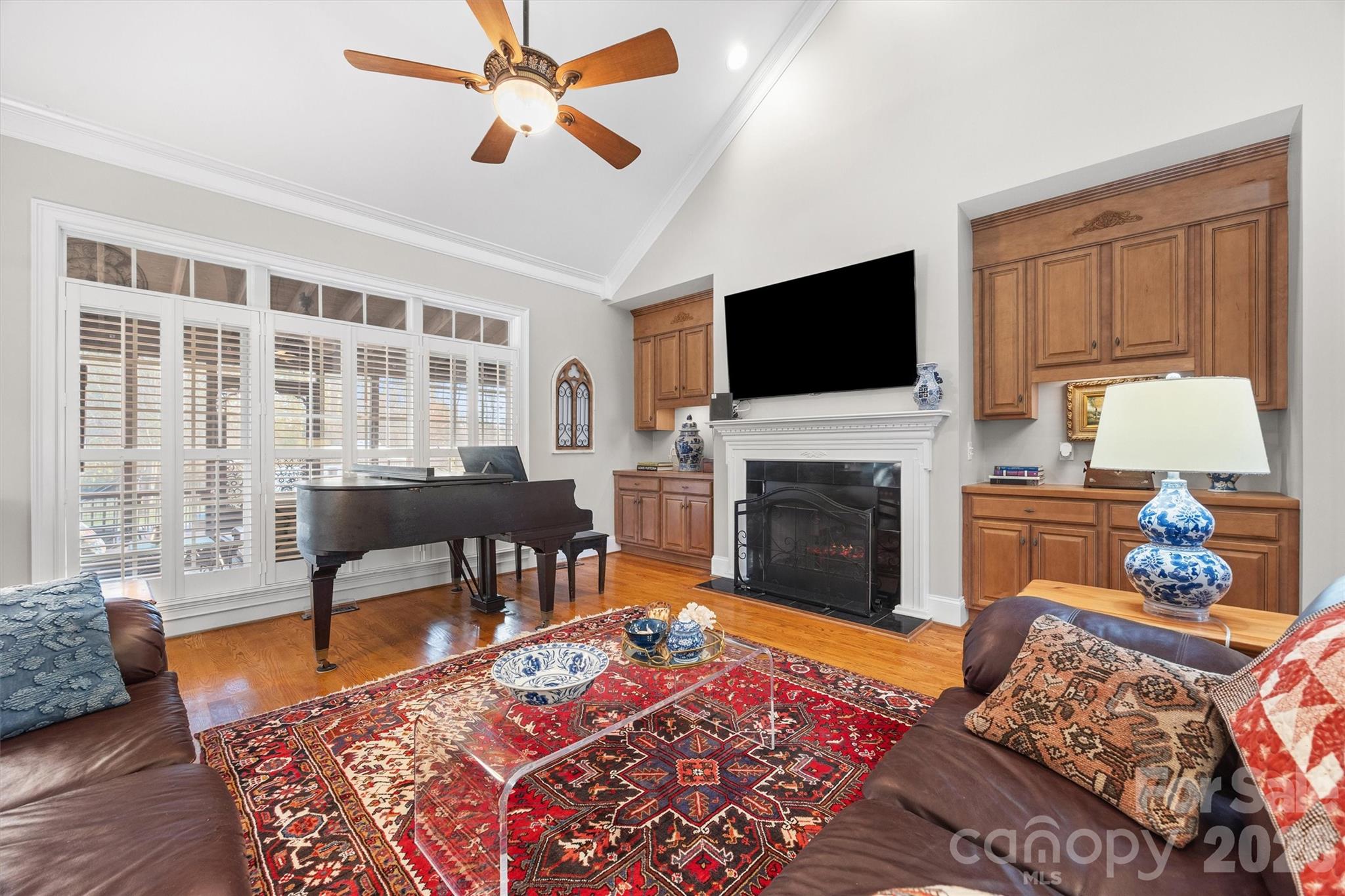1177 Springlake Road York, SC 29745 - Photo 8 of 48 a living room with furniture a fireplace and a flat screen tv