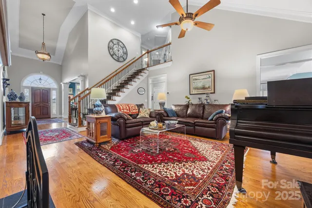 a living room with lots of furniture and a rug