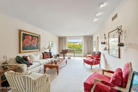 a living room with furniture and a large window