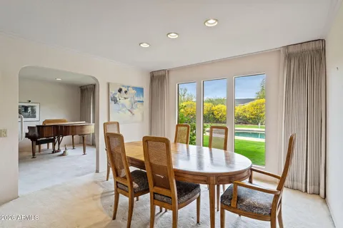 a view of a dining room with furniture window and outside view