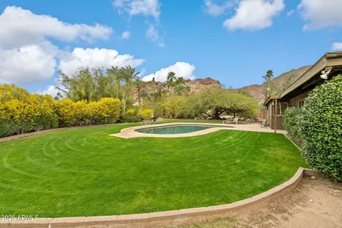 a view of a golf course with a lake