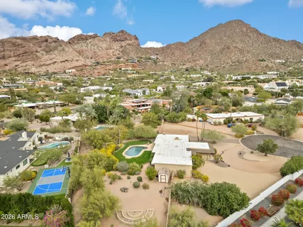 an aerial view of residential houses with outdoor space and street view