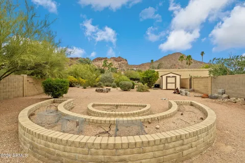 a view of a house with a swimming pool and a yard