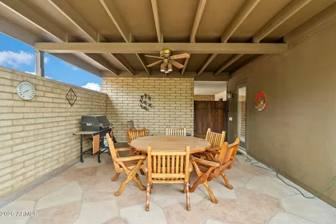 a patio with table and chairs