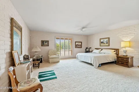 a bathroom with a granite countertop sink mirror and a shower