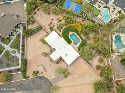 an aerial view of a house with a swimming pool