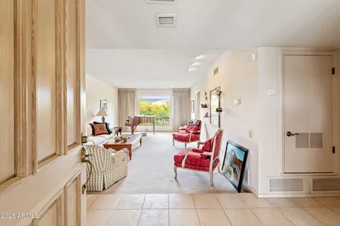 a living room with furniture and a large window
