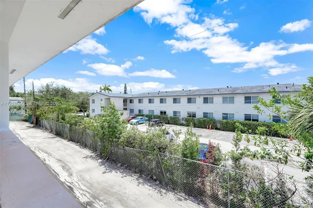 a view of a building with a yard