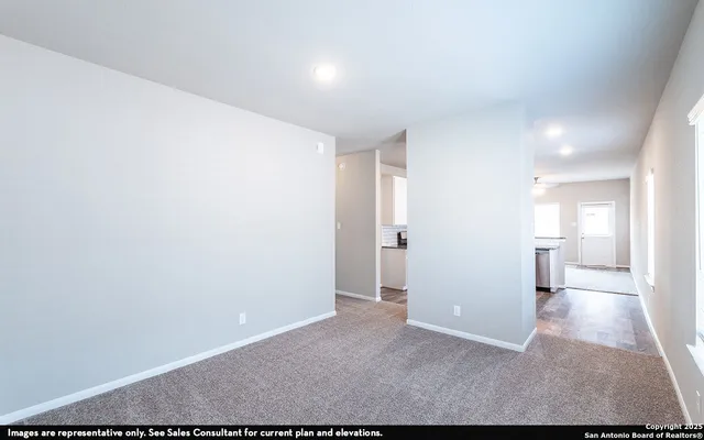 a view of a big room with wooden floor and a bathroom