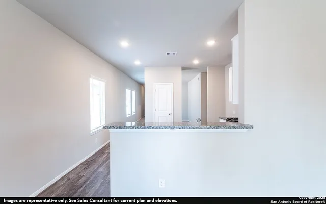 a view of a kitchen with granite countertop cabinets and a sink