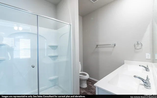 a bathroom with a sink and toilet