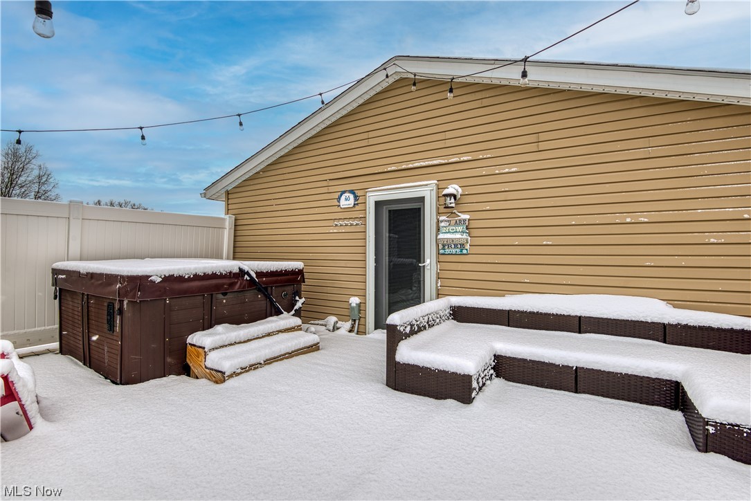8646 Yale Road Rootstown, OH 44272 - Photo 19 of 30 Snow covered patio with a hot tub