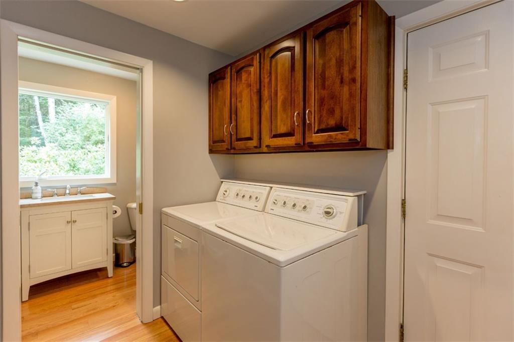 3 Oakridge Road Brunswick, ME 04011 - Photo 14 of 35 First floor laundry with cabinets to...