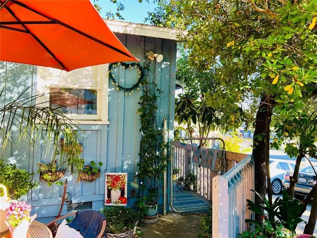 a view of the patio with chairs and tables