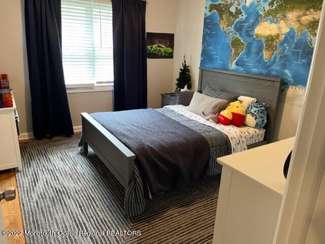 22 Robin Road Rumson, NJ 07760 - Photo 8 of 12 a bedroom with a bed and a window