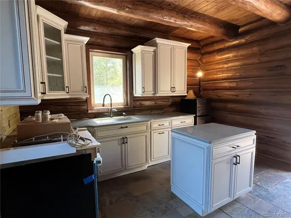 a kitchen that has a sink in it with a sink