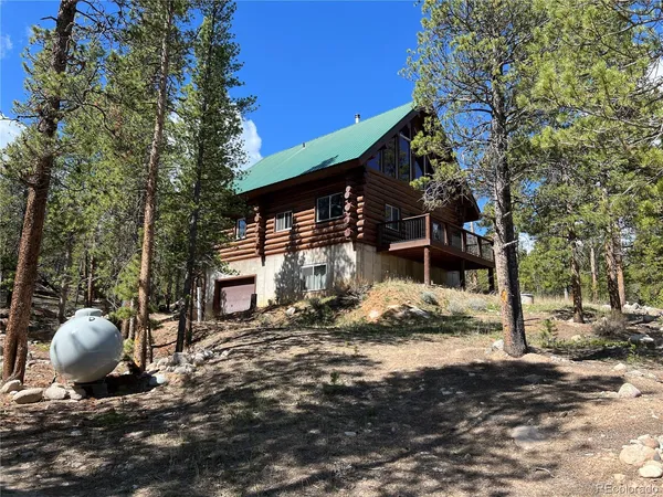 a view of a backyard of the house