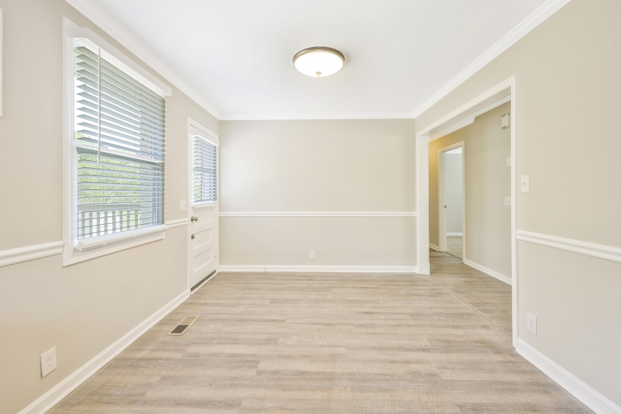 318 Bonnahurst Drive Hermitage, TN 37076 - Photo 20 of 30 a view of an empty room with wooden floor and a window