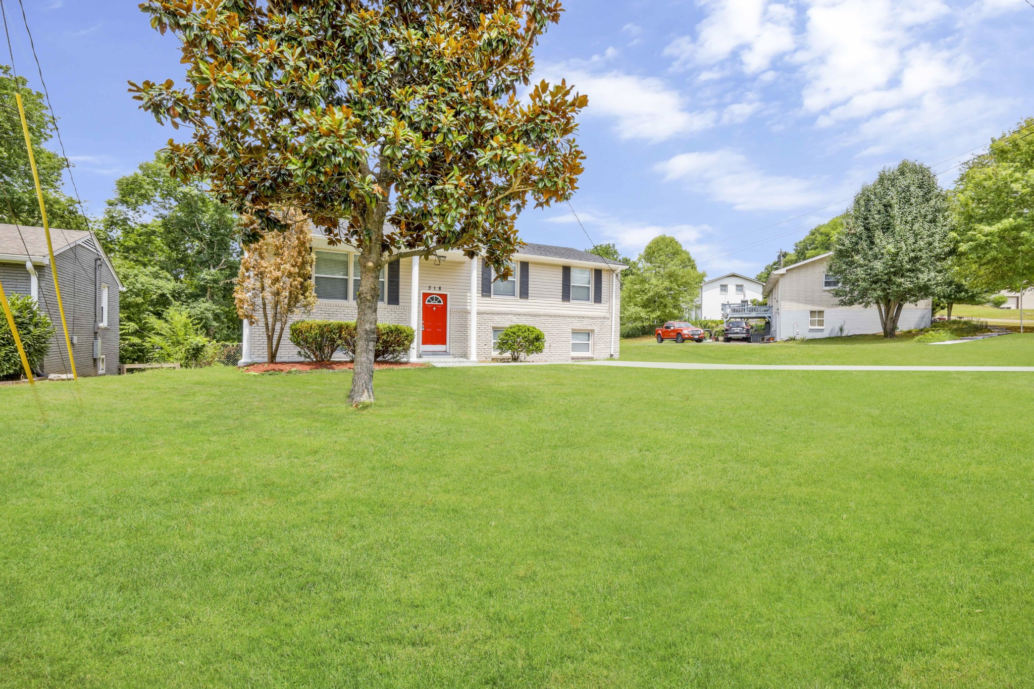 318 Bonnahurst Drive Hermitage, TN 37076 - Photo 2 of 30 a front view of a house with a yard and trees