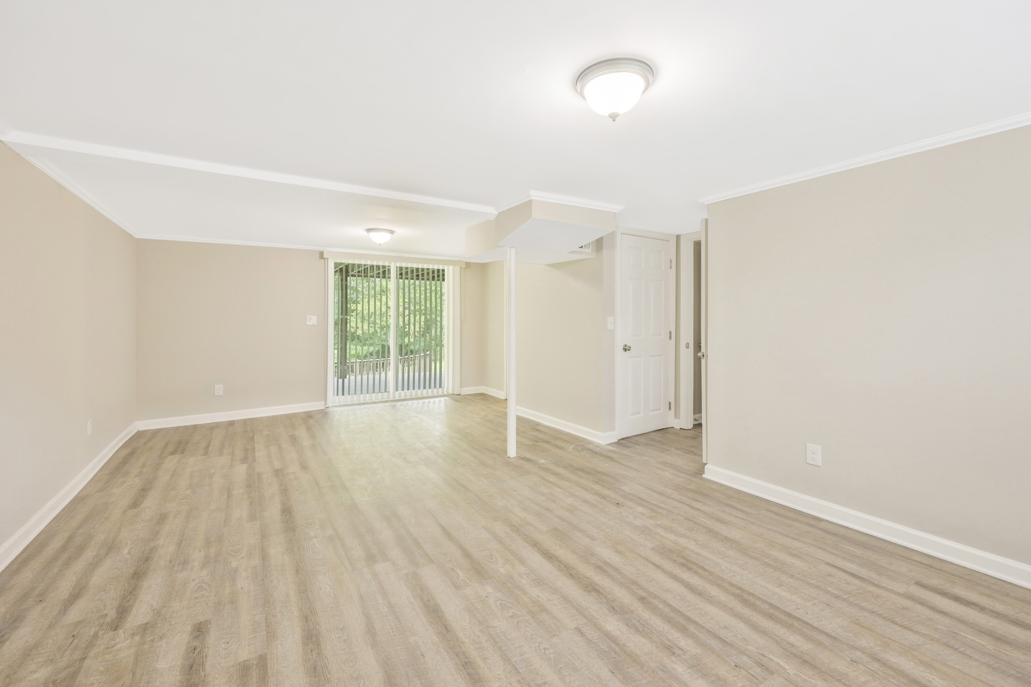 318 Bonnahurst Drive Hermitage, TN 37076 - Photo 27 of 30 an empty room with wooden floor and windows
