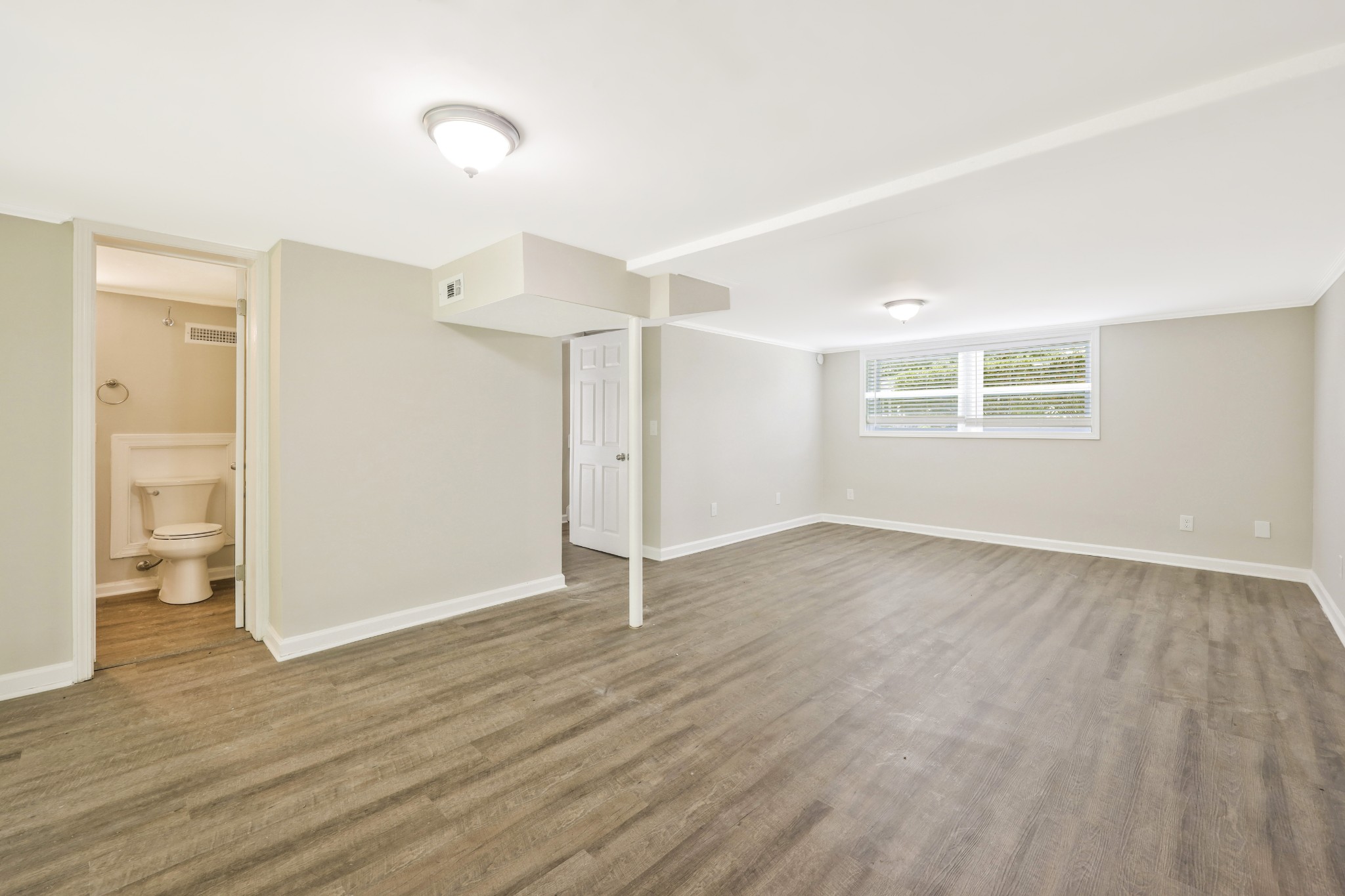 318 Bonnahurst Drive Hermitage, TN 37076 - Photo 28 of 30 an empty room with wooden floor and windows