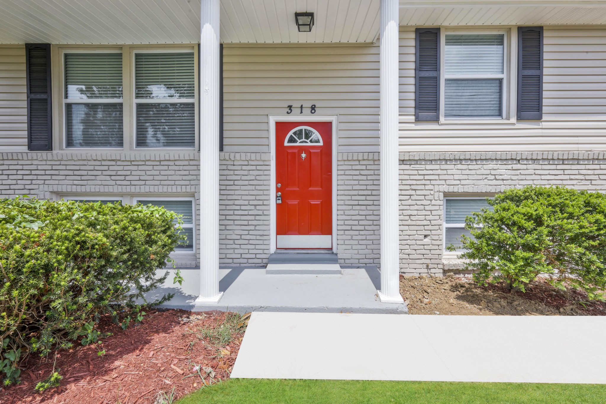 318 Bonnahurst Drive Hermitage, TN 37076 - Photo 4 of 30 a front view of a house with a yard and garage