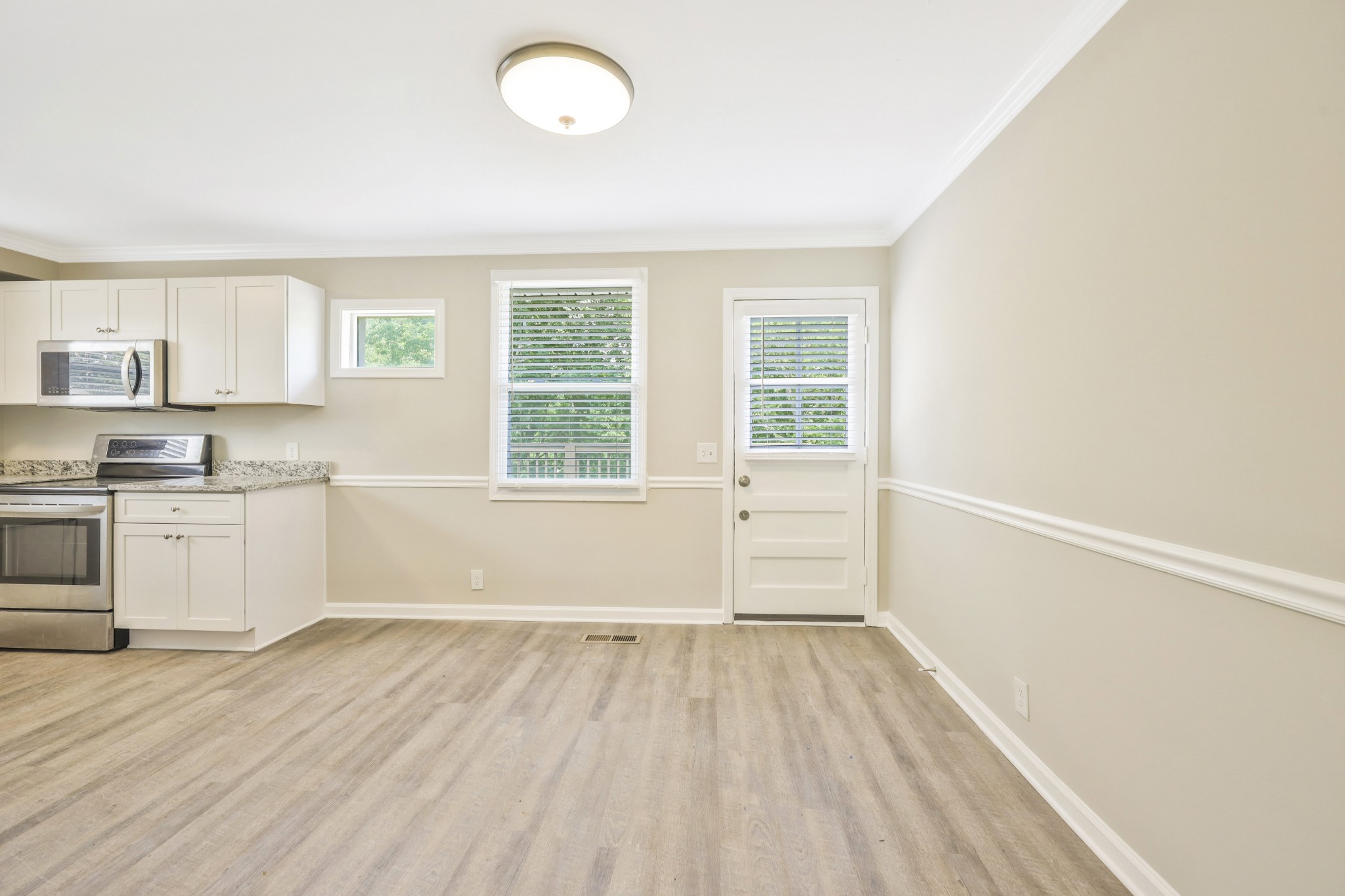 318 Bonnahurst Drive Hermitage, TN 37076 - Photo 5 of 30 a view of a kitchen with wooden floor and a window