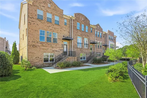 a view of a building with a yard