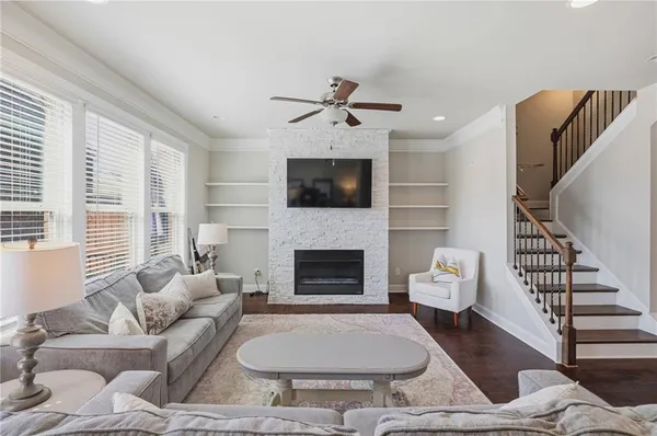 a living room with furniture and a fireplace