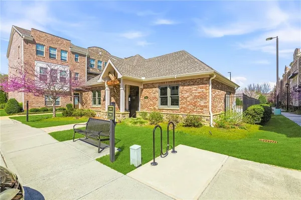 a front view of a house with a yard table and chairs