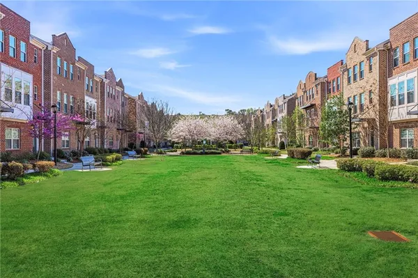 a view of a big yard and front of a building