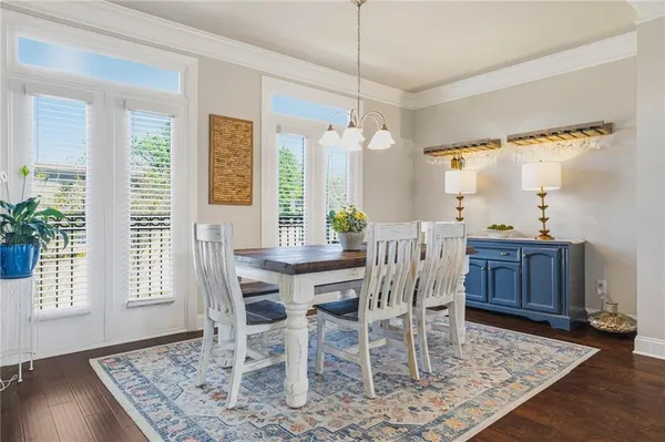 a view of a dining room with furniture and window