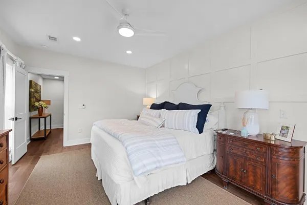 a bed room with a bed and a dresser