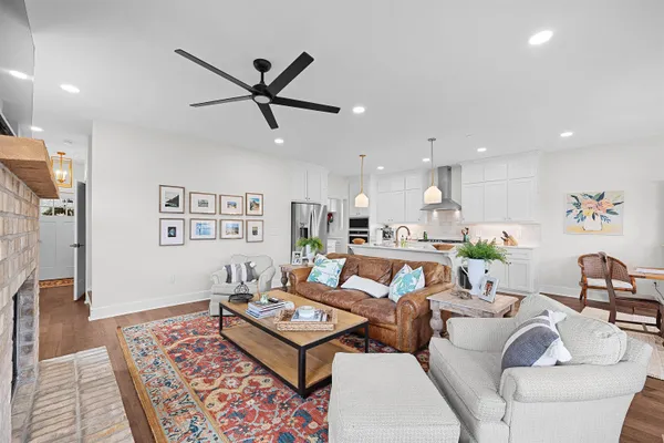 a living room with furniture and a rug