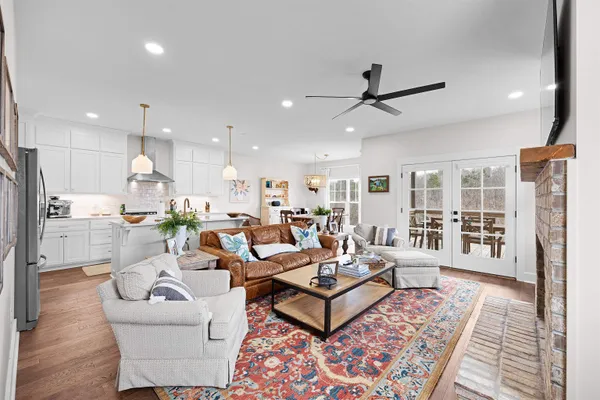 a living room with furniture and a rug