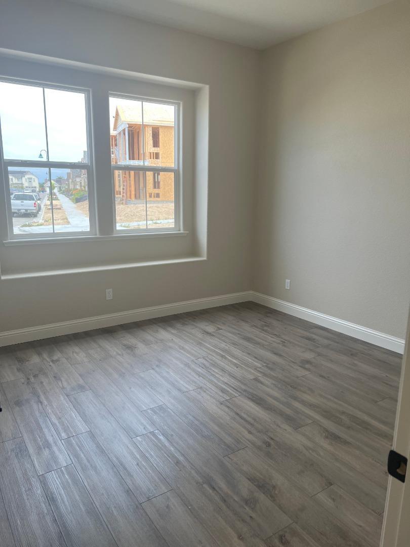 480 Lassen Way Marina, CA 93933 - Photo 6 of 19 wooden floor in an empty room with a window