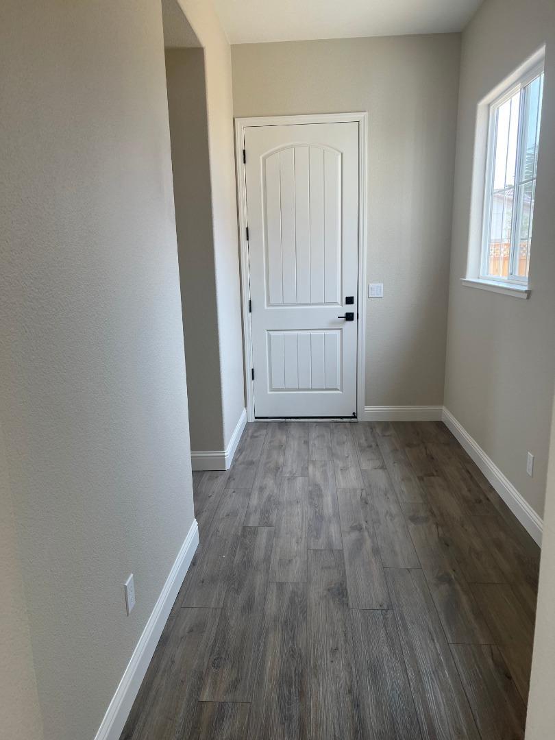 480 Lassen Way Marina, CA 93933 - Photo 7 of 19 an empty room with wooden floor and windows